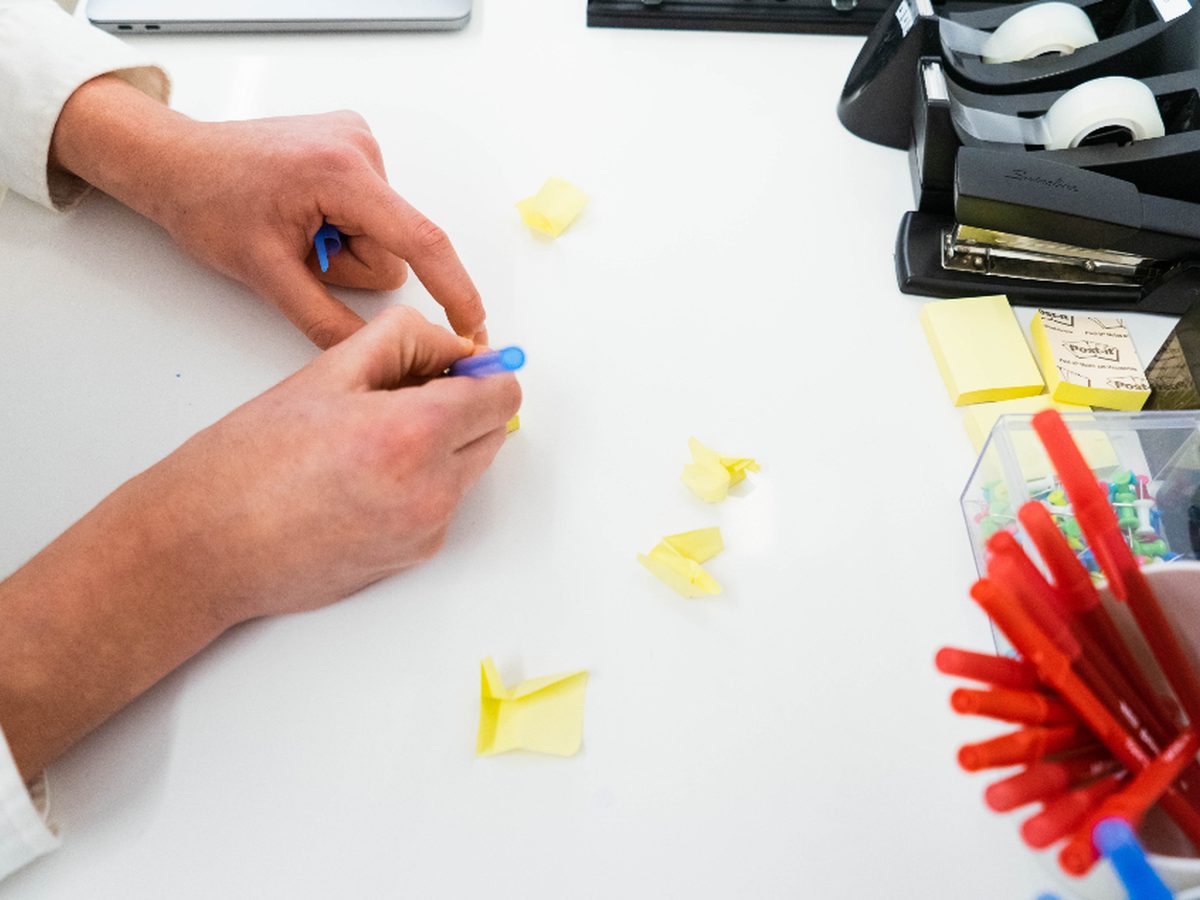 A small business job mapped out step by step on a whiteboard